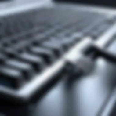 Close-up of a laptop keyboard being cleaned with a dust blower